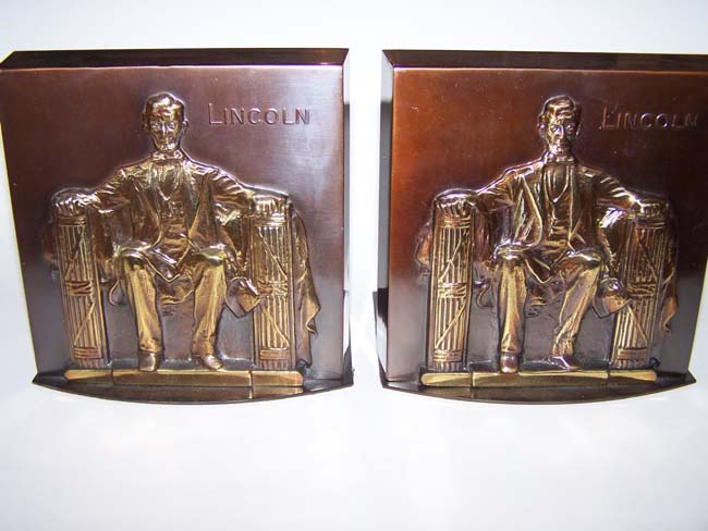A pair of 'Lincoln in the chair' base relief bronzed bookends circa 1960